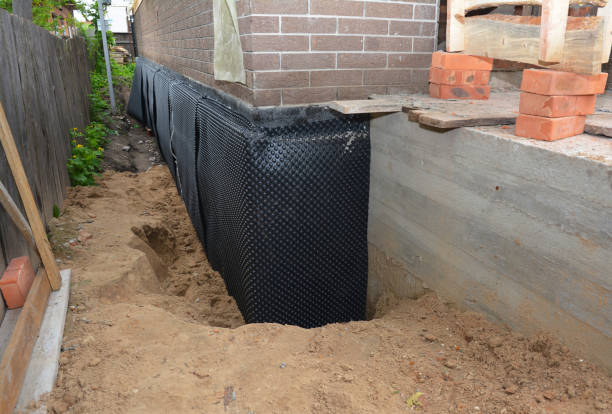 SJ Waterproofing Pros technician performing targeted Interior Drainage System assessment in Waverly, MI